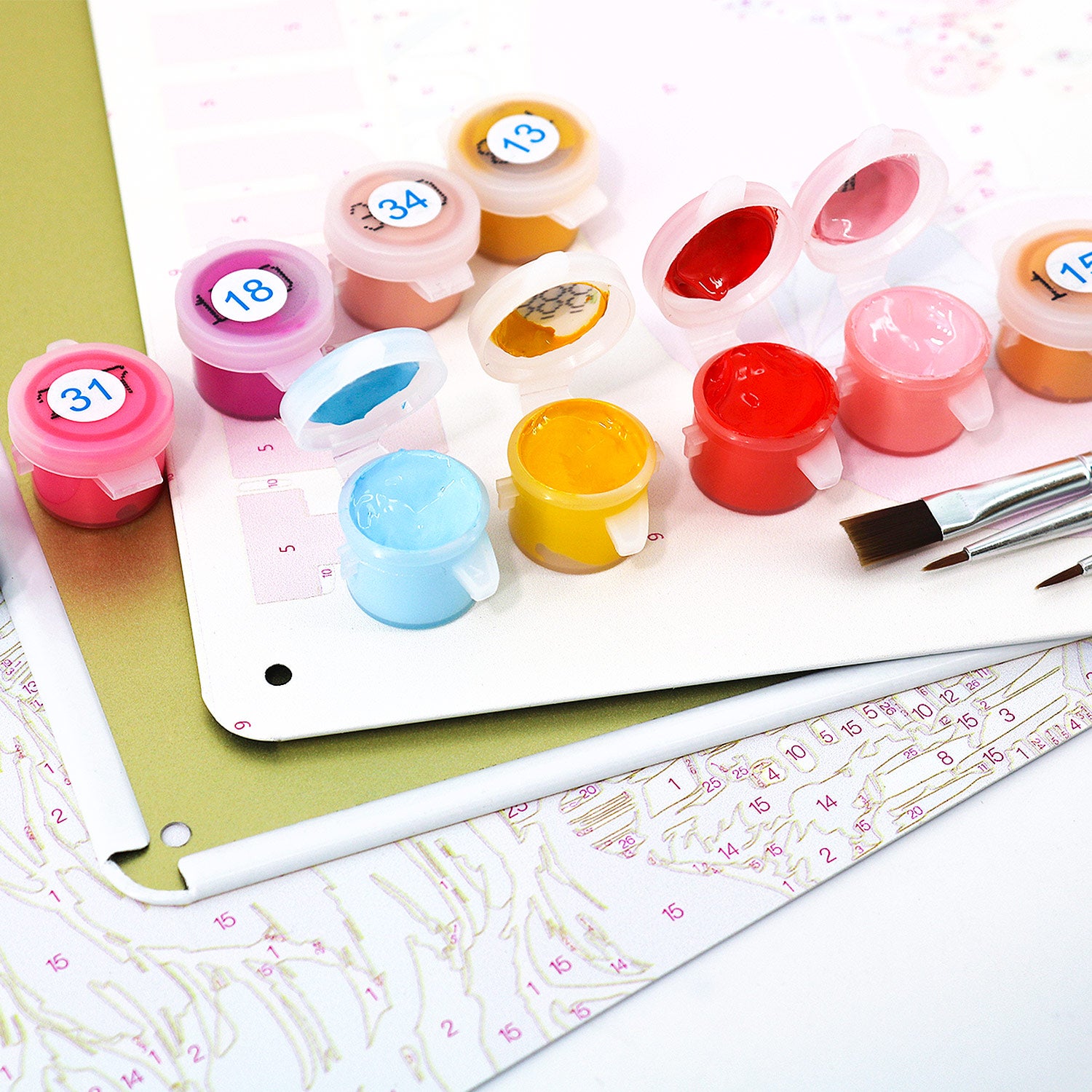 Paint by numbers set with colorful paint pots and brush on guided artwork for vintage rustic metal posters.